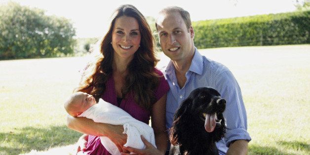 BUCKLEBURY, BERKSHIRE - AUGUST 2013: (EDITORIAL USE ONLY - NO SALES) In this handout image provided by Kensington Palace, Catherine, Duchess of Cambridge and Prince William, Duke of Cambridge pose for a photograph with their son, Prince George Alexander Louis of Cambridge, surrounded by Lupo, the couple's cocker spaniel, and Tilly the retriever (a Middleton family pet) in the garden of the Middleton family home in August 2013 in Bucklebury, Berkshire. (Photo by Michael Middleton - WPA Pool/Getty Images)