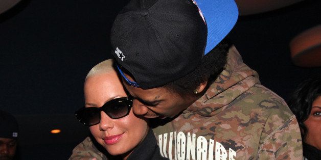 (L-R) Amber Rose and Wiz Khalifa attend the 'Roll One With Wiz Khalifa' Bowling Party at Chelsea Piers on March 28, 2011 in New York City.