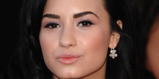 LOS ANGELES, CA - NOVEMBER 22: Singer Demi Lovato arrives at the 2009 American Music Awards at Nokia Theatre L.A. Live on No