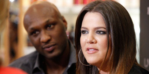 ORANGE, CA - JUNE 07: Professional basketball player Lamar Odom and TV personality Khloe Kardashian make an appearance to promote their fragrance, 'Unbreakable Bond,' at Perfumania on June 7, 2012 in Orange, California. (Photo by Imeh Akpanudosen/Getty Images)