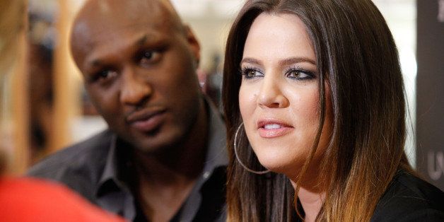 ORANGE, CA - JUNE 07: Professional basketball player Lamar Odom and TV personality Khloe Kardashian make an appearance to promote their fragrance, 'Unbreakable Bond,' at Perfumania on June 7, 2012 in Orange, California. (Photo by Imeh Akpanudosen/Getty Images)