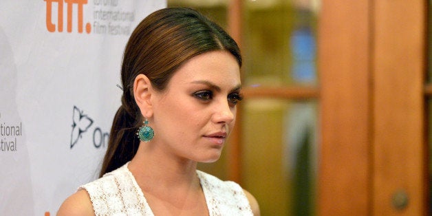 TORONTO, ON - SEPTEMBER 09: Actress Mila Kunis arrives at the 'Third Person' Premiere during the 2013 Toronto International Film Festival at The Elgin on September 9, 2013 in Toronto, Canada. (Photo by Alberto E. Rodriguez/Getty Images)