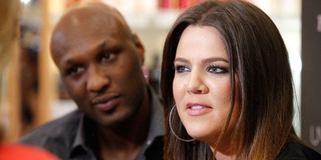 ORANGE, CA - JUNE 07: Professional basketball player Lamar Odom and TV personality Khloe Kardashian make an appearance to promote their fragrance, 'Unbreakable Bond,' at Perfumania on June 7, 2012 in Orange, California. (Photo by Imeh Akpanudosen/Getty Images)