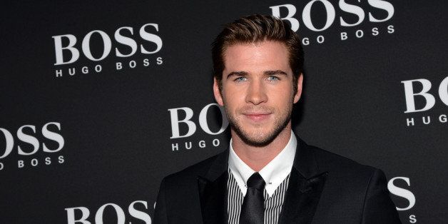 NEW YORK, NY - SEPTEMBER 24: Actor Liam Hemsworth attends HUGO BOSS celebrates Columbus Circle BOSS flagship opening featuring premiere of 'Anthropocene,' by Marco Brambilla on September 24, 2013 in New York City. (Photo by Mike Coppola/Getty Images for Hugo Boss)