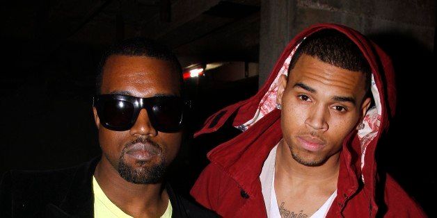 PARIS - JANUARY 22: Kanye West and Chris Brown attend the John Galliano fashion show during Paris Menswear Fashion Week Autumn/Winter 2010 on January 22, 2010 in Paris, France. (Photo by Michel Dufour/WireImage)