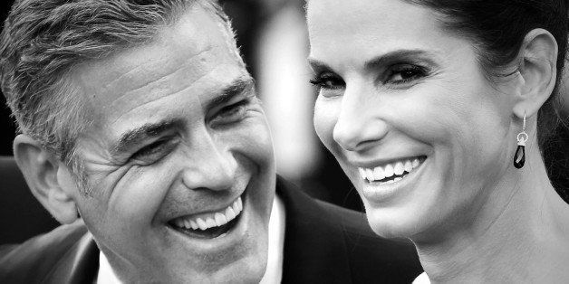 VENICE, ITALY - AUGUST 28: (EDITORS NOTE: Image has been converted to black and white) Actors George Clooney and Sandra Bullock attend the Opening Ceremony And 'Gravity' Premiere at Palazzo del Cinema on August 28, 2013 in Venice, Italy. (Photo by Franco Origlia/Getty Images)