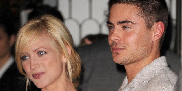 WEST HOLLYWOOD, CA - JANUARY 09: Actress Brittany Snow (L) and actor Zac Efron arrive at Audi and Designer J. Mendel's Kick