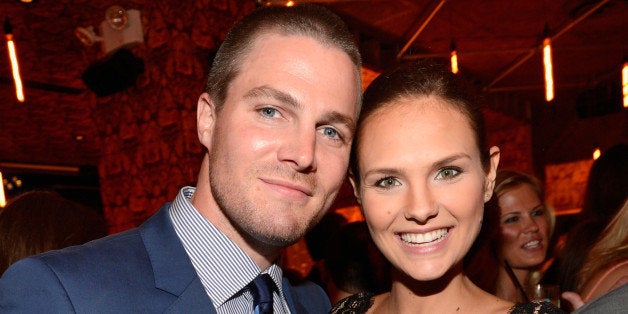 NEW YORK, NY - MAY 16: (Exclusive Coverage) Stephen Amell and Cassandra Jean attend The CW Network's 2013 Upfront party at FINALE on May 16, 2013 in New York City. (Photo by Kevin Mazur/WireImage)