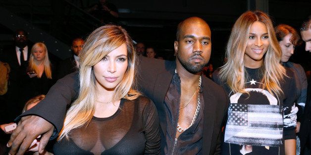 PARIS, FRANCE - SEPTEMBER 29: Kim Kardashian, Kanye West and singer Ciara attend Givenchy show as part of the Paris Fashion Week Womenswear Spring/Summer 2014, held at 'la Halle Freyssinet' on September 29, 2013 in Paris, France. (Photo by Bertrand Rindoff Petroff/Getty Images)