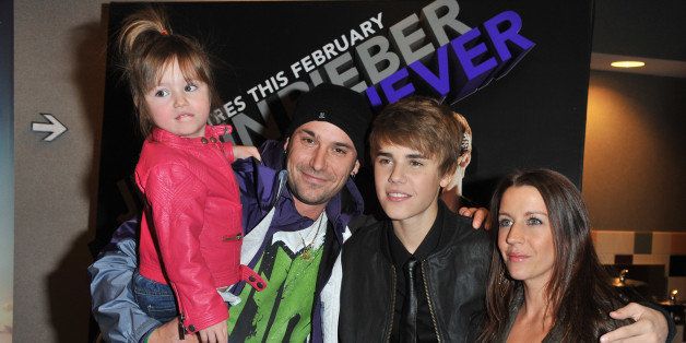 (L-R) Sister Jazmyn Bieber, father Jeremy Bieber, singer Justin Bieber and mother Pattie Lynn Mallete attend the premiere for 'Never Say Never' at the AMC Yonge & Dundas 24 theater on February 1, 2011 in Toronto, Canada.