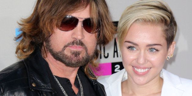 LOS ANGELES, CA - NOVEMBER 24: Singer Billy Ray Cyrus (L) and daughter singer Miley Cyrus attend the 2013 American Music Awards at Nokia Theatre L.A. Live on November 24, 2013 in Los Angeles, California. (Photo by David Livingston/Getty Images)
