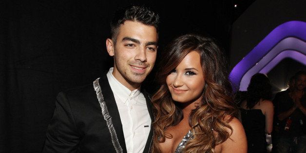LOS ANGELES, CA - AUGUST 28: Singer Joe Jonas and Singer Demi Lovato arrive at the 2011 MTV Video Music Awards at Nokia Theatre L.A. LIVE on August 28, 2011 in Los Angeles, California. (Photo by Christopher Polk/Getty Images)