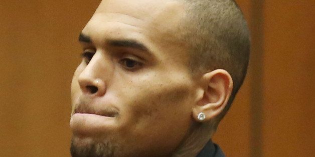 LOS ANGELES, CA - NOVEMBER 20: Recording artist Chris Brown appears in Los Angeles court on November 20, 2013 in Los Angeles, California. Brown was ordered to 90 days at an inpatient center, random drug testing and 24 hours of weekly community service. Brown was arrested last month for misdemeanor assault in Washington, DC and was already on probation for a felony domestic violence charge after a 2009 incident with then-girlfriend Rihanna. (Photo by Frederick M. Brown/Getty Images)