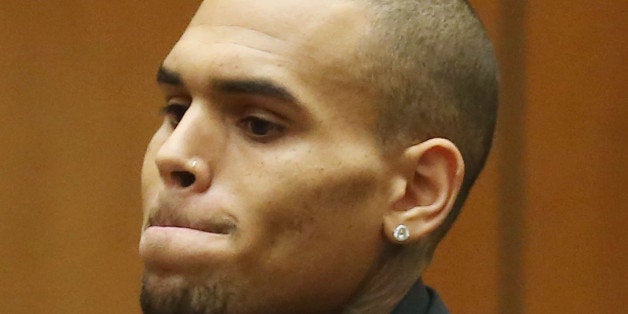 LOS ANGELES, CA - NOVEMBER 20: Recording artist Chris Brown appears in Los Angeles court on November 20, 2013 in Los Angeles