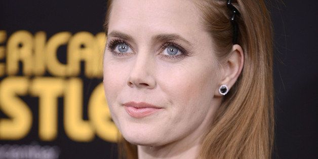 NEW YORK, NY - DECEMBER 08: Actress Amy Adams attends the 'American Hustle' screening at Ziegfeld Theater on December 8, 2013 in New York City. (Photo by Gary Gershoff/WireImage)
