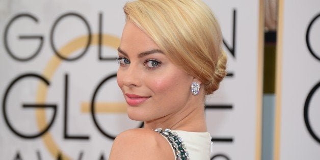 Actress Margot Robbie arrives on the red carpet of the 71st Annual Golden Globe Awards in Beverly Hills, California, on January 12, 2014. AFP PHOTO/Frederic J. BROWN (Photo credit should read FREDERIC J. BROWN/AFP/Getty Images)