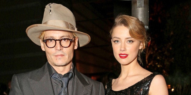 LOS ANGELES, CA - JANUARY 11: Actor Johnny Depp (L) and actress Amber Heard attend Perrier-Jouet Celebration of The Art of E