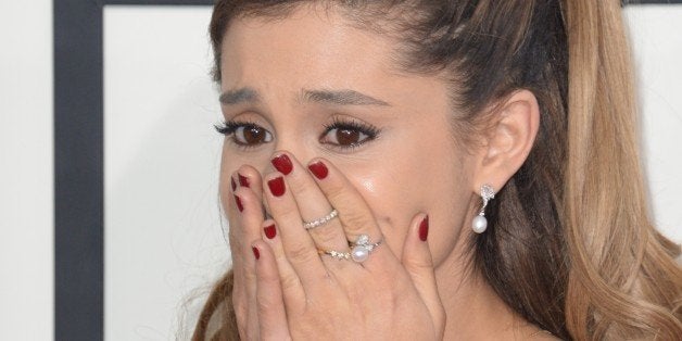 Ariana Grande arrives on the red carpet for the 56th Grammy Awards at the Staples Center in Los Angeles, California, January 26, 2014. AFP PHOTO ROBYN BECK (Photo credit should read ROBYN BECK/AFP/Getty Images)