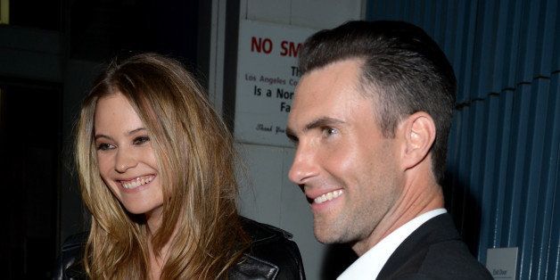 LOS ANGELES, CA - JANUARY 27: Model Behati Prinsloo (L) and singer-songwriter Adam Levine attend 'The Night That Changed America: A GRAMMY Salute To The Beatles' at the Los Angeles Convention Center on January 27, 2014 in Los Angeles, California. (Photo by Lester Cohen/WireImage)