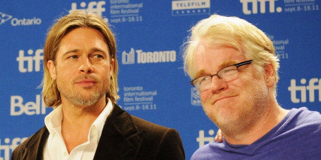 TORONTO, ON - SEPTEMBER 09: Actors Jonah Hill, Brad Pitt and Philip Seymour Hoffman speak onstage at 'Moneyball' Press Confe
