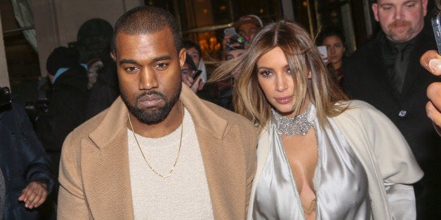 PARIS, FRANCE - JANUARY 21: Kanye West and Kim Kardashian leave the 'Meurice' hotel on January 21, 2014 in Paris, France. (