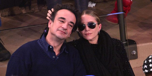 NEW YORK, NY - DECEMBER 14: Olivier Sarkozy and Mary-Kate Olsen attend the Atlanta Hawks vs New York Knicks game at Madison Square Garden on December 14, 2013 in New York City. (Photo by James Devaney/WireImage)