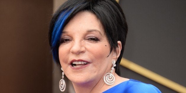 Actress Liza Minnelli arrives on the red carpet for the 86th Academy Awards on March 2nd, 2014 in Hollywood, California. AFP PHOTO / Robyn BECK (Photo credit should read ROBYN BECK/AFP/Getty Images)