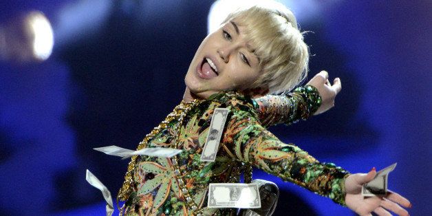 HOUSTON, TX - MARCH 16: Miley Cyrus performs part of her Bangerz Tour at the Toyota Center on March 16, 2014 in Houston, Texas. (Photo by Tim Mosenfelder/WireImage)
