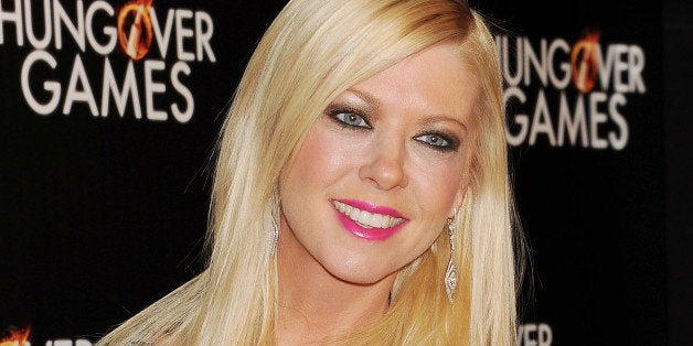 HOLLYWOOD, CA- FEBRUARY 11: Actress Tara Reid attends the Los Angeles Premiere of 'The Hungover Games' at TCL Chinese Theatre