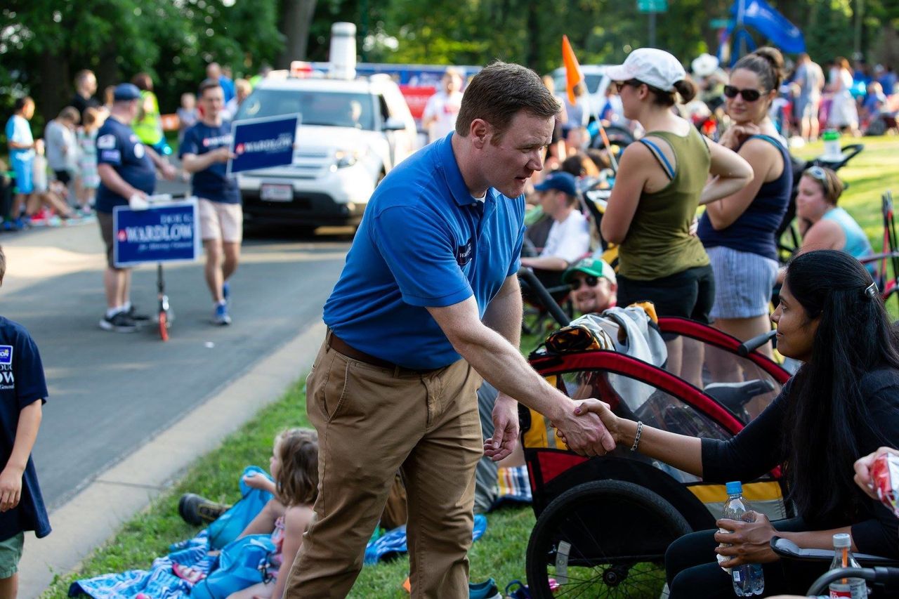 Doug Wardlow, the Republican nominee for Minnesota attorney general, greets a voter at an event over the summer.