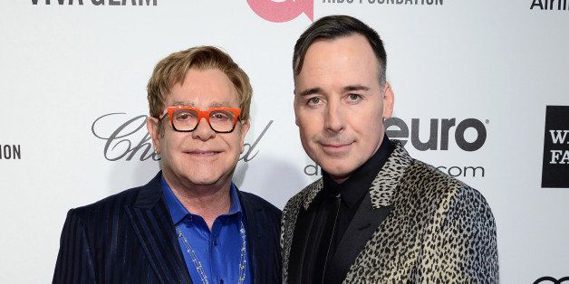 WEST HOLLYWOOD, CA - MARCH 02: Sir Elton John and David Furnish arrive for the 22nd Annual Elton John AIDS Foundation's Oscar Viewing Party held at West Hollywood Park on March 2, 2014 in West Hollywood, California. (Photo by Karwai Tang/WireImage)