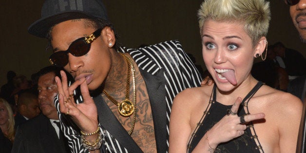 LOS ANGELES, CA - FEBRUARY 09: Rapper Wiz Khalifa (L) and singer Miley Cyrus attend the 55th Annual GRAMMY Awards Pre-GRAMMY Gala and Salute to Industry Icons honoring L.A. Reid held at The Beverly Hilton on February 9, 2013 in Los Angeles, California. (Photo by Lester Cohen/WireImage)