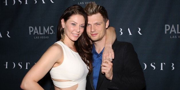 LAS VEGAS, NV - FEBRUARY 08: Singer Nick Carter of the Backstreet Boys (R) and his fiancee Lauren Kitt arrive to celebrate their coed bachelor and bachelorette party at Ghostbar at the Palms Casino Resort on February 8, 2014 in Las Vegas, Nevada. (Photo by Gabe Ginsberg/FilmMagic)