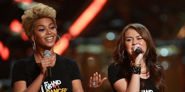 NEW YORK - SEPTEMBER 05: Singers Beyonce and Miley Cyrus perform on stage during the Conde Nast Media Group's Fifth Annual F