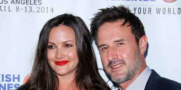 HOLLYWOOD, CA - APRIL 08: Actors Christina McLarty (L) and David Arquette (R) attend the Indian Film Festival of Los Angeles opening night gala at ArcLight Cinemas on April 8, 2014 in Hollywood, California. (Photo by Paul Archuleta/FilmMagic)