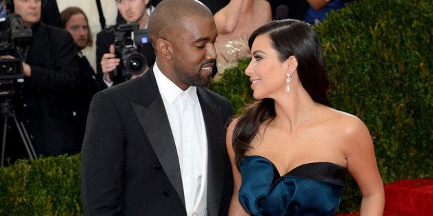 NEW YORK, NY - MAY 05: Kanye West (L) and Kim Kardashian attend attend the 'Charles James: Beyond Fashion' Costume Institute Gala at the Metropolitan Museum of Art on May 5, 2014 in New York City. (Photo by Dimitrios Kambouris/Getty Images)