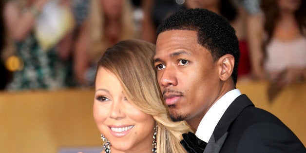 LOS ANGELES, CA - JANUARY 18: Mariah Carey and Nick Cannon (R) arrive at the 20th Annual Screen Actors Guild Awards at the Shrine Auditorium on January 18, 2014 in Los Angeles, California. (Photo by Dan MacMedan/WireImage)