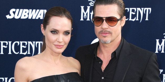 HOLLYWOOD, CA - MAY 28: Angelina Jolie and Brad Pitt arrives at the World Premiere Of Disney's 'Maleficent' at the El Capitan Theatre on May 28, 2014 in Hollywood, California. (Photo by Steve Granitz/WireImage)