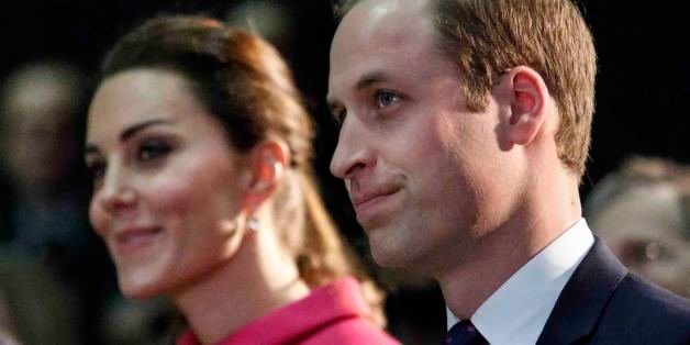Britain's Prince William, Duke of Cambridge, and his wife Catherine, Duchess of Cambridge, attend a show as they visit The Door on December 9, 2014 in New York. The Door provides services to disadvantaged young people. (AP Photo/Kena Betancur, Pool)