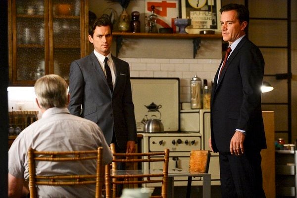 Matt Bomer as Neal Caffrey, Tim DeKay as Peter Burke -- News Photo