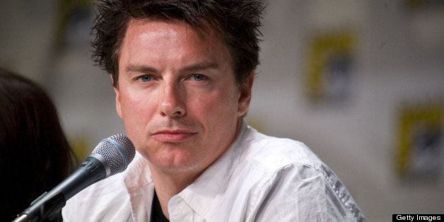 SAN DIEGO, CA - JULY 22: John Barrowman speaks on stage during day two of Comic-Con 2011 held at the San Diego Convention Center on July 22, 2011 in San Diego, California. (Photo by Wendy Redfern/Redferns)