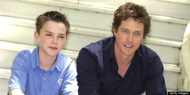 MADRID, SPAIN - JUNE 18: Actors Nicholas Hoult (L) and Hugh Grant (R) attend the photo call for the Spanish promotion of their movie 'About a Boy' at the Hotel Ritz June 18, 2002 in Madrid, Spain. (Photo by Carlos Alvarez/Getty Images) 