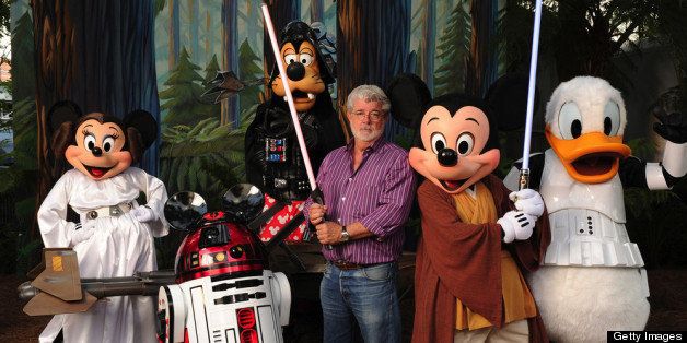 LAKE BUENA VISTA, FL - AUGUST 14: In this handout image provided by Disney, with the stern and determined look of a Jedi Knight, 'Star Wars' creator and filmmaker George Lucas poses with a group of 'Star Wars'-inspired Disney characters Aug. 14, 2010 at Disney's Hollywood Studios theme park in Lake Buena Vista, Fla. Lucas is in central Florida for 'Star Wars Celebration V,' the official Lucasfilm fan event that is taking place this week at the Orange County Convention Center in Orlando, Fla. He visited Walt Disney World Resort tonight to attend Disney's 'Last Tour to Endor' special event. (Photo by Todd Anderson/Disney via Getty Images)