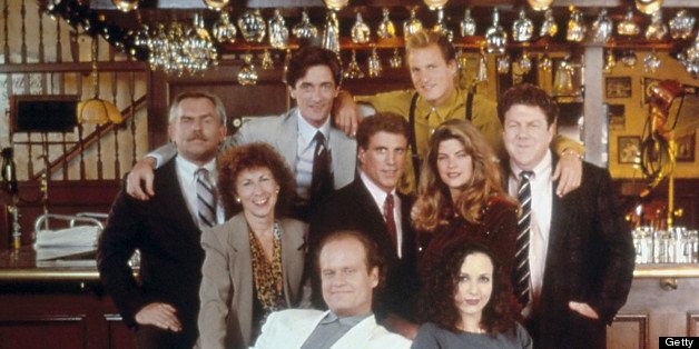 CHEERS -- Pictured: (back row, l-r) John Ratzenberger as Cliff Clavin, Roger Rees as Robin Colcord, Woody Harrelson as Woody Boyd (middle, l-r) Rhea Perlman as Carla Tortelli, Ted Danson as Sam Malone, Kirstie Alley as Rebecca Howe, George Wendt as Norm Peterson, (front, l-r) Kelsey Grammer as Dr. Frasier Crane, Bebe Neuwirth as Dr. Lilith Sternin-Crane (Photo by NBC/NBCU Photo Bank via Getty Images)