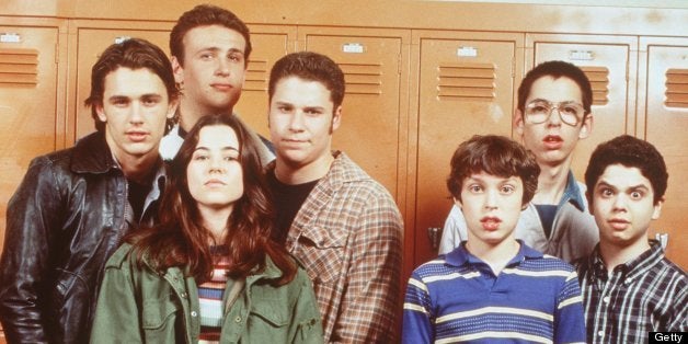 The cast of 'Freaks And Geeks.' From l-r: James Franco (as Daniel), Linda Cardellini (as Lindsay Weir, front, green jacket), Seth Rogan (as Ken Miller, plaid shirt), John Daley (as Sam Weir, front blue striped shirt), Martin Starr (as Bill Havenchuck, back wearing glasses) and Samm Levine (as Neal, far right). Photo credit: Chris Haston NBC, Inc. All Rights Reserved.