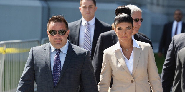 NEWARK, NJ - AUGUST 14: Giuseppe 'Joe' Giudice (L) and wife Teresa Giudice leave court after facing charges of defrauding lenders, illegally obtaining mortgages and other loans as well as allegedly hiding assets and income during a bankruptcy case on August 14, 2013 in Newark, United States. (Photo by Mike Coppola/Getty Images)