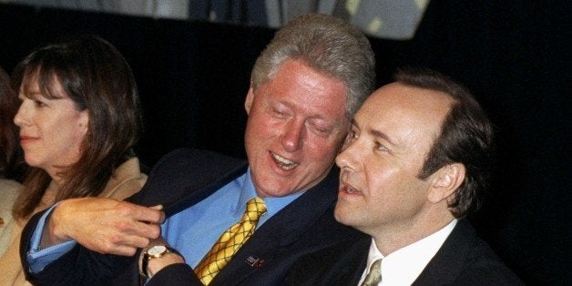 UNITED STATES - CIRCA 2000: President Bill Clinton chats with actor Kevin Spacey at a fund-raiser for Harlem Rep. Charles Ra