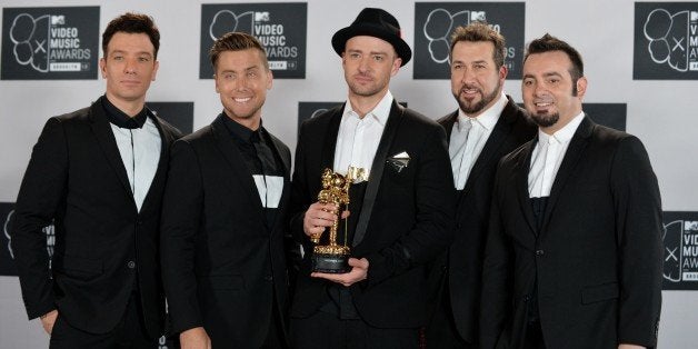 A reunited 'N Sync including Justin Timberlake (C), JC Chasez (L), Lance Bass (2nd L), Joey Fatone (2nd R), and Chris Kirkpatrick (R) at the MTV Video Music Awards August 25, 2013 at the Barclays Center in New York. AFP PHOTO/Stan HONDA (Photo credit should read STAN HONDA/AFP/Getty Images)