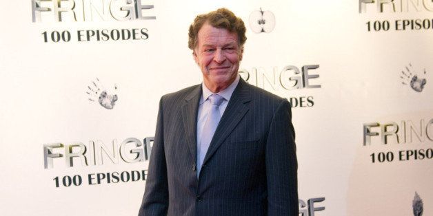 VANCOUVER, CANADA - DECEMBER 01: John Noble poses for a photo on the red carpet while attending 'Fringe' celebrates 100 episodes and final season at Fairmont Pacific Rim on December 1, 2012 in Vancouver, Canada. (Photo by Rich Lam/Getty Images for FOX)