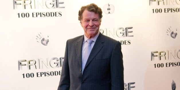 VANCOUVER, CANADA - DECEMBER 01: John Noble poses for a photo on the red carpet while attending 'Fringe' celebrates 100 epis